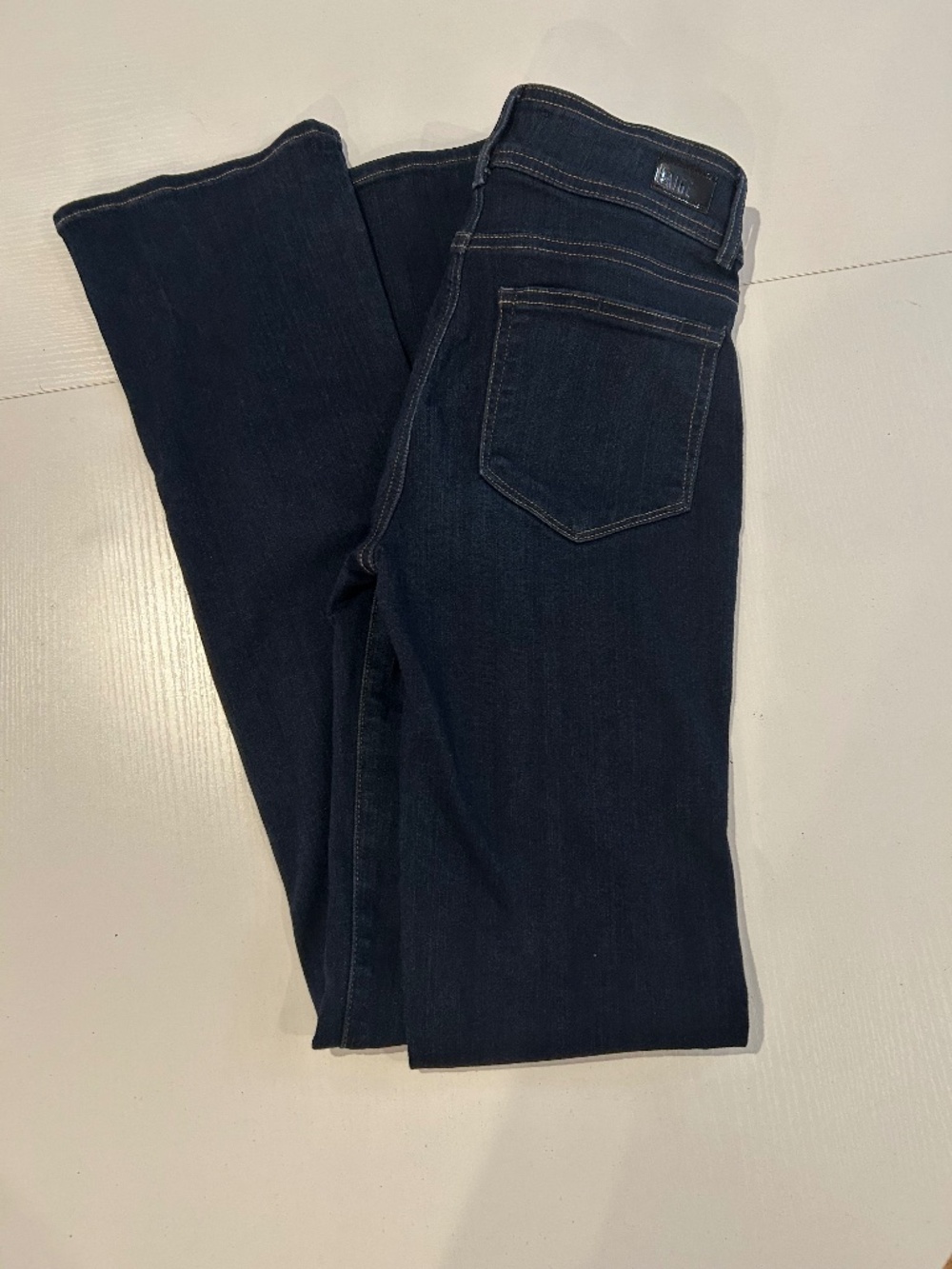 Paige size 27  HIGH RISE MANHATTAN DARK BLUE WASH NEVER WORN
